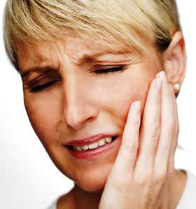 Woman in pain with TMJ