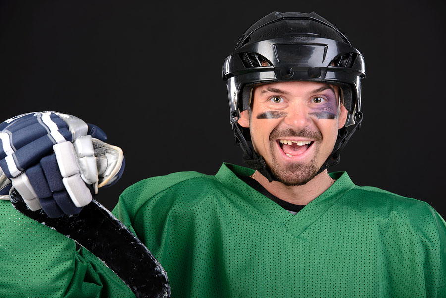 Hockey player with a missing tooth